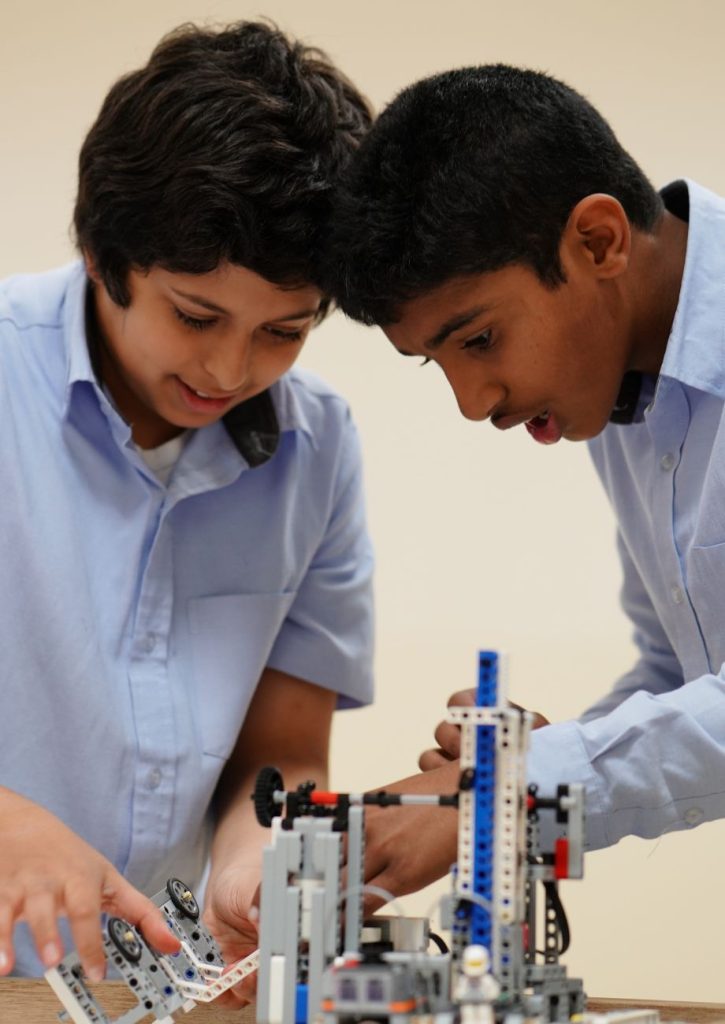 Two students of the American Curriculum of Abu Dhabi International School working on a science project